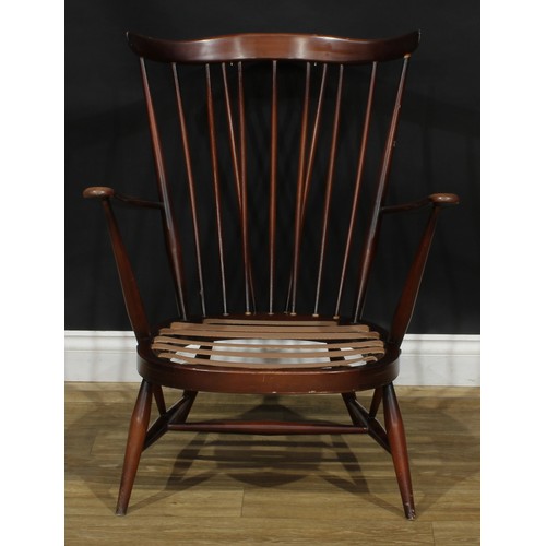 415 - An Ercol Fleur De Lys low armchair, Old Colonial range, 81.5cm high, 70cm wide, the seat 46cm wide a... 