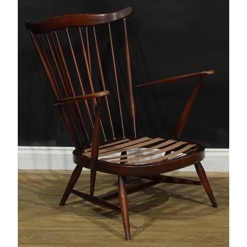 415 - An Ercol Fleur De Lys low armchair, Old Colonial range, 81.5cm high, 70cm wide, the seat 46cm wide a... 