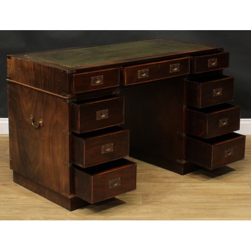 419 - A contemporary campaign inspired twin pedestal desk, 76.5cm high, 119.5cm wide, 60cm deep