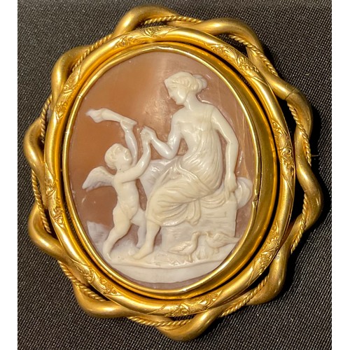 1183 - A 19th century pinchbeck shell cameo swivel broock, carved with Venus and Cupid, 8cm long