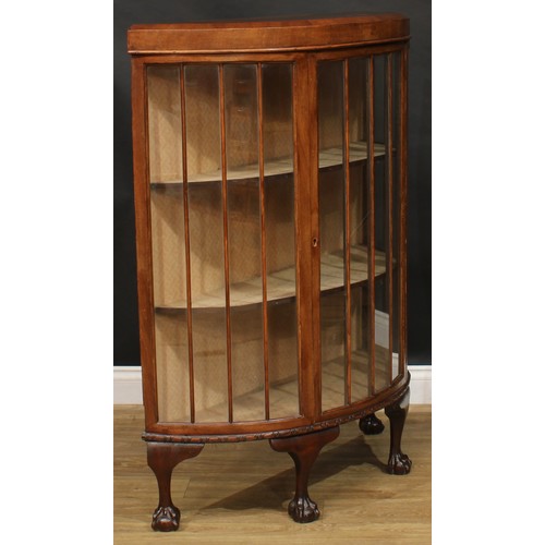 808 - An early 20th century walnut demilune display cabinet, 123cm high, 101cm wide, 36cm deep, c.1935