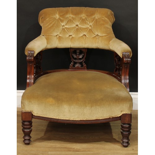 815 - A late Victorian/Edwardian club elbow chair, 73cm high, 64cm wide, the seat 51cm wide and 49cm deep;... 