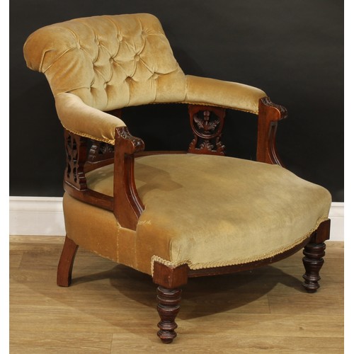 815 - A late Victorian/Edwardian club elbow chair, 73cm high, 64cm wide, the seat 51cm wide and 49cm deep;... 