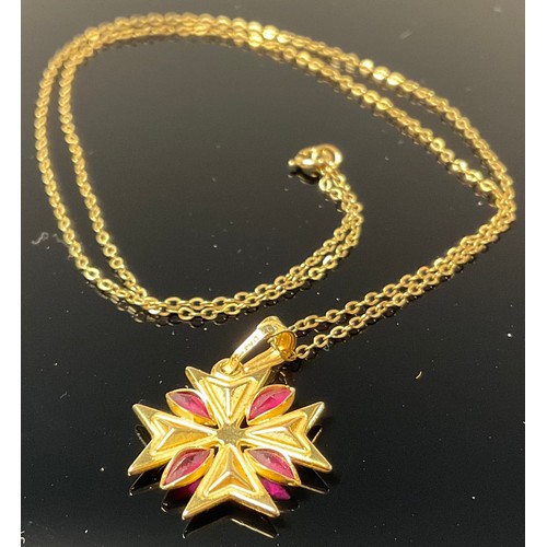 1197 - A 9ct gold Maltese cross pendant, set with stones