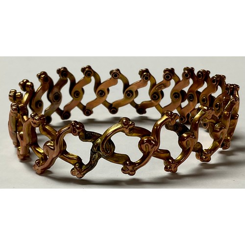 1198 - A late 19th century 9ct yellow and rose gold expanding bracelet, consisting of openwork scroll links... 