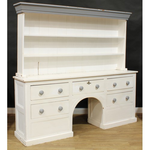 10A - A late 19th/early 20th century painted pine dog kennel dresser, moulded cornice above a pair of plat... 