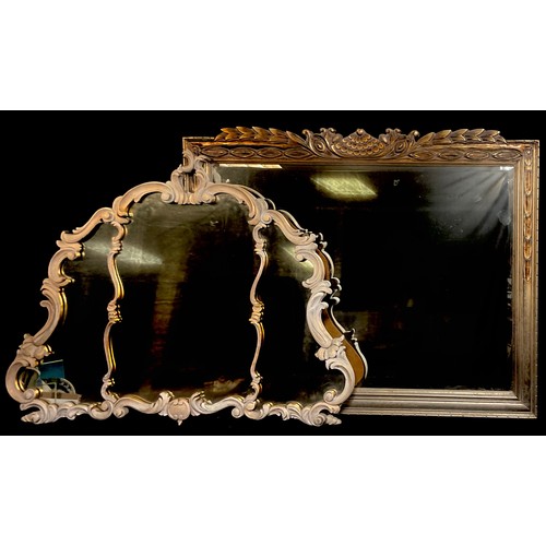 1235 - A large modern wall mirror, 94cm x118cm; another modern Rococo style wall mirror, 90cm x 114cm (2)