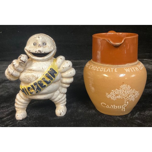 1230 - A Bourne Denby advertising jug, Cadbury's Bournville Cocoa, 15cm; a cast metal figure, of the Michel... 