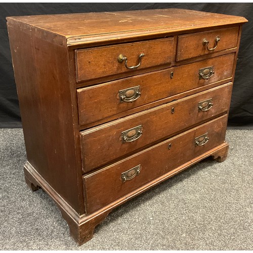 50 - A George III oak chest of two short over three long graduated drawers, brass swan-neck handles, brac... 