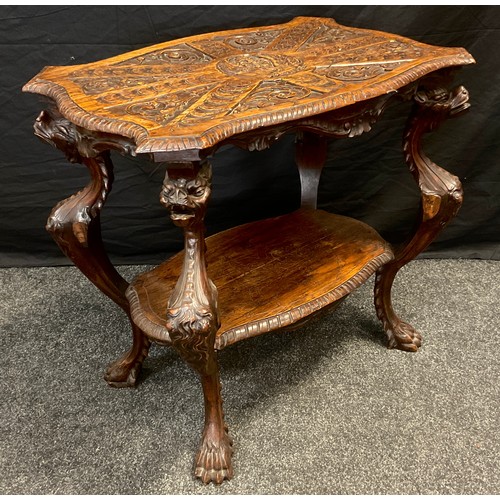 72 - An Italianate carved oak centre table, shaped top, carved with a book with text Pax Evan, Ti Bi Geli... 