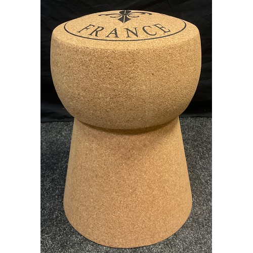 75 - Interior design - an over-sized champagne cork, as a stool, 49cm high.