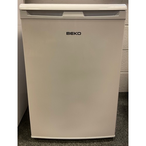 317 - A Beko under counter freezer, model number FXF5033W, three deep drawers to interior.