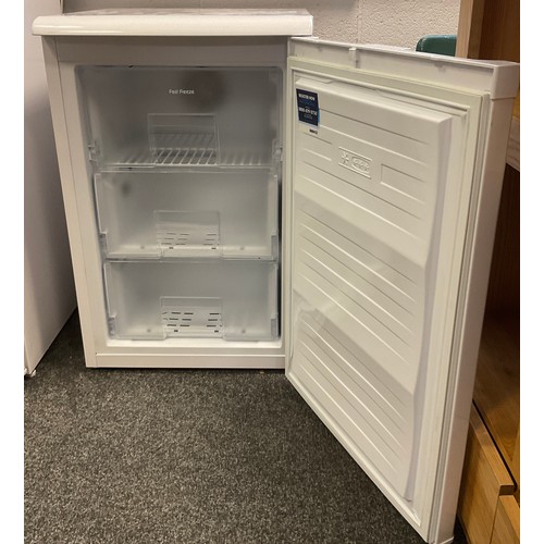 317 - A Beko under counter freezer, model number FXF5033W, three deep drawers to interior.