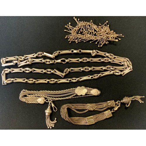 416 - A Victorian silver fancy link Albert chain necklace, 88cm long;  multi strand bracelet etc, mostly u... 