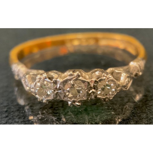 435 - A diamond ring, liner set with three old brilliant cut diamonds, total estimated diamond weight appr... 