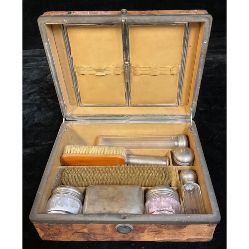 54 - A 19th century crocodile skin bound dressing box, the hinged cover enclosing fitted trifold mirror, ... 