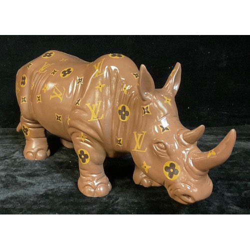 194 - Interior Design - a Louis Vuitton style abstract sculpture of a rhinoceros, 55cm wide