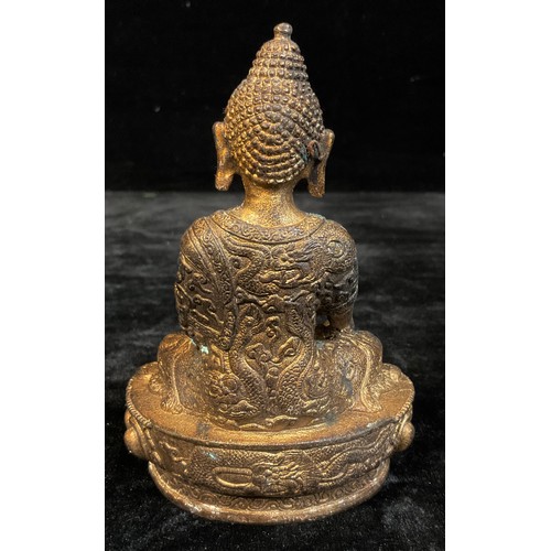 226 - A contemporary gilt bronzed metal figure, Buddha seated cross legged, 14cm high