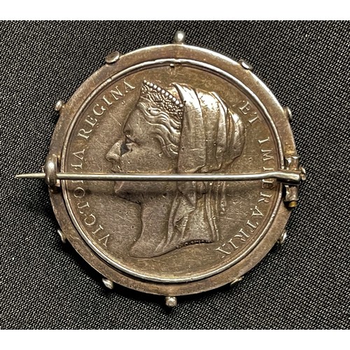 5003 - Victorian Egypt Campaign Medal which has been mounted into a circular cog wheel design frame and bro... 