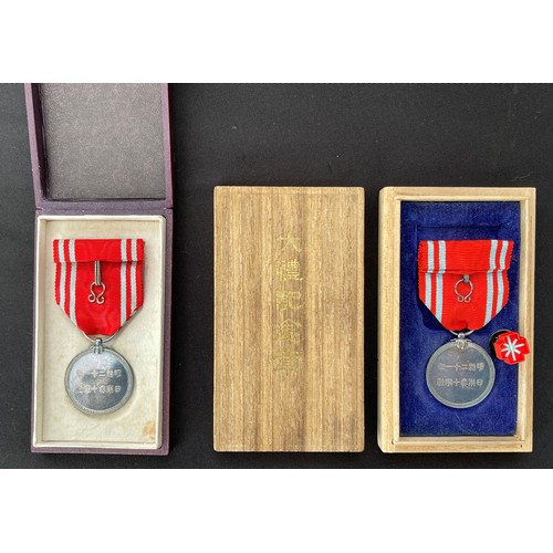 5022 - Pair of cased Japanese Red Cross Medals. (2)