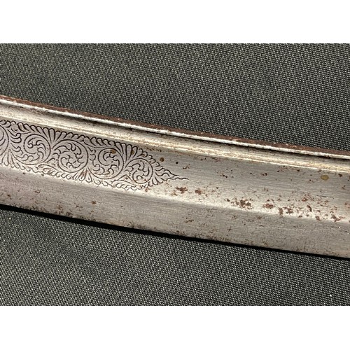 5106 - Indonesian Sword with curved fullered single edged blade 400mm in length, engraved decoration to the... 