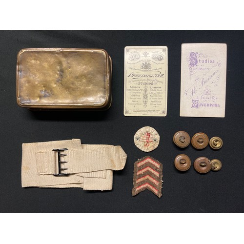 5142 - WW1 British Princess Mary's Gift Tin 1914 containing a Red Cross printed armband, Red Cross badge on... 