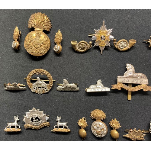 5192 - WW2 British Cap Badges together with matching Collar Dogs to include: Border Regt: Devonshire Regt: ... 