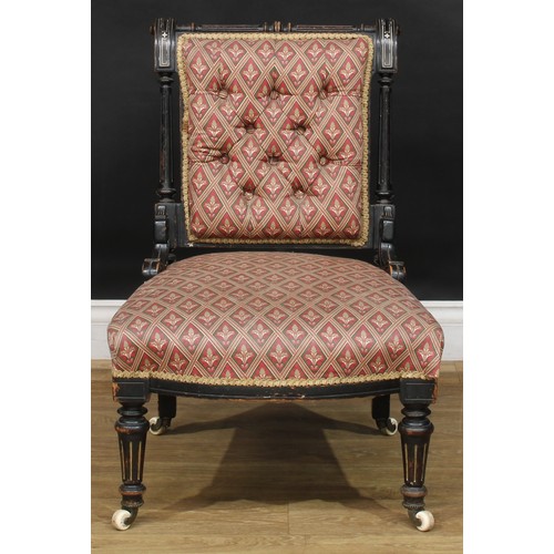 106 - A late Victorian Eastlake Movement spoonback armchair, 93cm high, 70cm wide, the seat 49cm wide and ... 