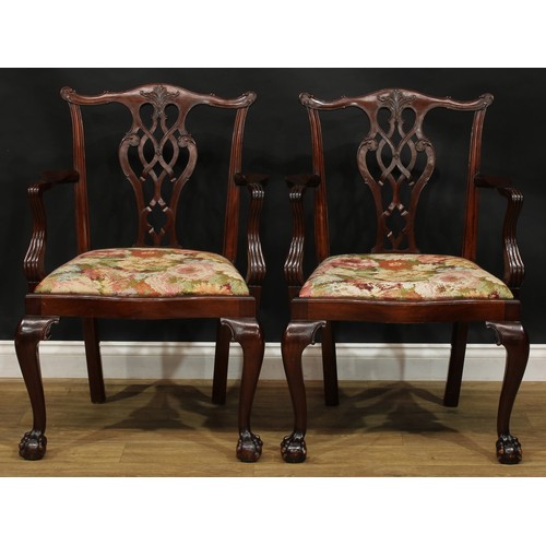 111 - A pair of Chippendale Revival mahogany elbow chairs, 97cm high, 67cm wide, the seat 54cm wide and 45... 