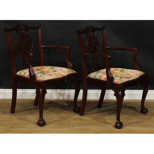 111 - A pair of Chippendale Revival mahogany elbow chairs, 97cm high, 67cm wide, the seat 54cm wide and 45... 