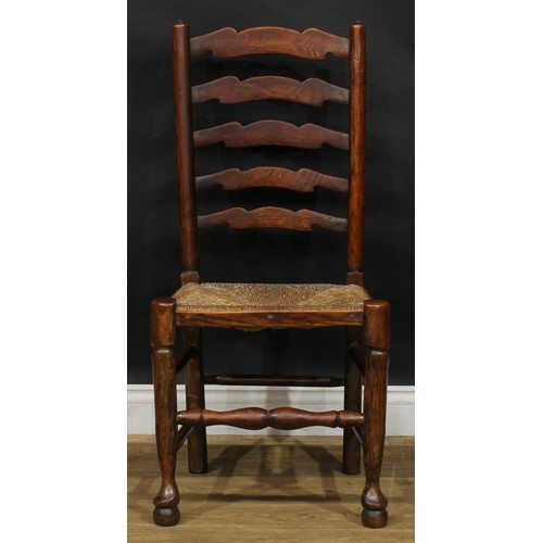 216 - A set of four Lancashire ladderback dining chairs, 101cm high, 49.5cm wide, the seat 36cm deep (4)