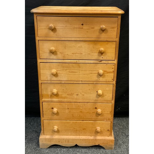 40 - A mid 20th century pine wellington chest, six short drawers, 106cm high x 60cm wide x 34.5cm deep.