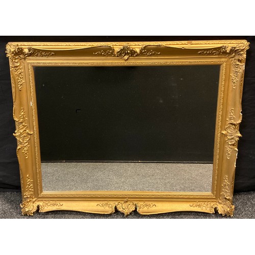 84 - A large ornate gilt framed wall mirror 61cm x 81.5cm glass size;  two further wall mirrors, (3).