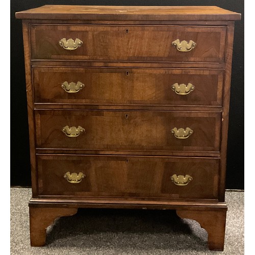 260 - An early 20th century, George III style, reproduction walnut chest of drawers, cross-banded over-sai... 