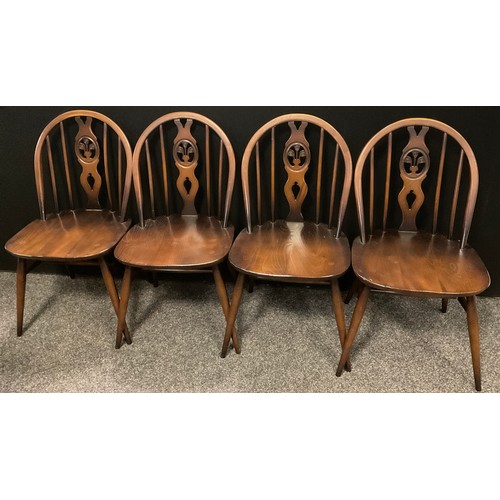 275 - A set of six Ercol, Fleur-de-Lys model, Spindle and Splat-back chairs, comprised of four chairs and ... 