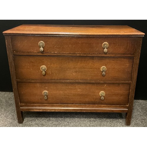 288 - A 1950’s oak chest of three drawers, and a matching two drawer dressing chest, (2).