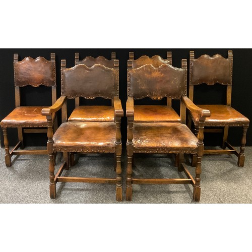 321 - A set of eight early 20th century oak dining chairs, tan leather upholstered backs and seats, turned... 