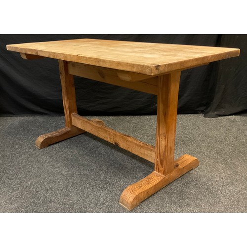 325 - A Victorian pine trestle table, 76cm high x 136cm x 70.5cm.