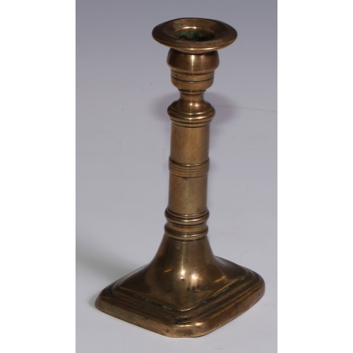 3653 - The Duke of Wellington and the Napoleonic Wars - a pair of George III brass candlesticks, campana sc... 