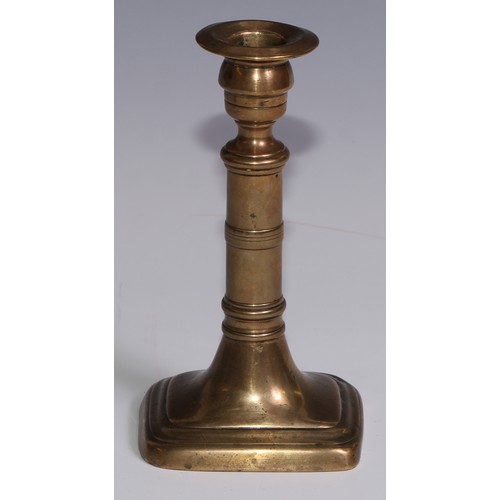 3653 - The Duke of Wellington and the Napoleonic Wars - a pair of George III brass candlesticks, campana sc... 