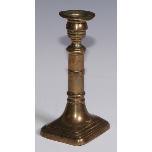 3653 - The Duke of Wellington and the Napoleonic Wars - a pair of George III brass candlesticks, campana sc... 