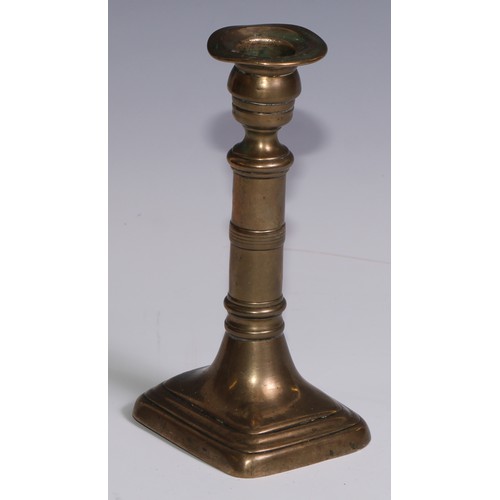 3653 - The Duke of Wellington and the Napoleonic Wars - a pair of George III brass candlesticks, campana sc... 