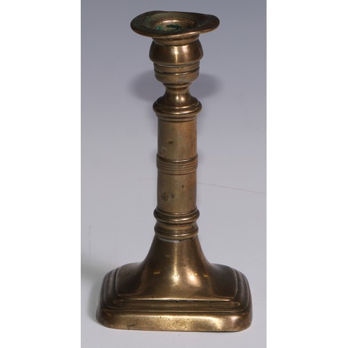 3653 - The Duke of Wellington and the Napoleonic Wars - a pair of George III brass candlesticks, campana sc... 