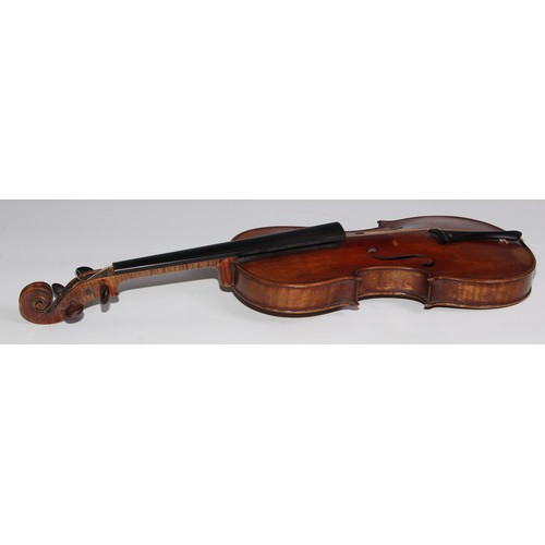 3062 - A 19th century violin, the well figured one-piece back 36cm long excluding button, outlined througho... 