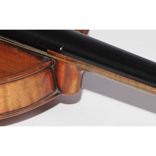 3062 - A 19th century violin, the well figured one-piece back 36cm long excluding button, outlined througho... 