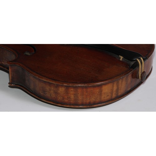 3062 - A 19th century violin, the well figured one-piece back 36cm long excluding button, outlined througho... 