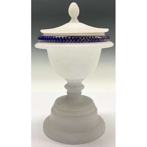 3027 - A 19th century frosted glass sweetmeat vase and cover, the rim trailed in blue and gilt with a snake... 