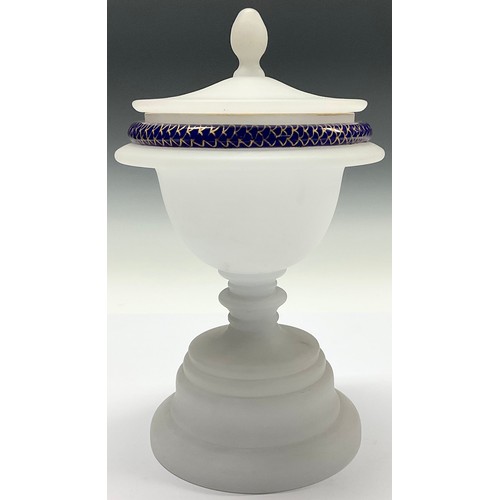 3027 - A 19th century frosted glass sweetmeat vase and cover, the rim trailed in blue and gilt with a snake... 