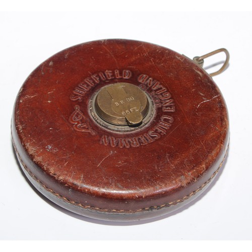 3638 - Railwayana - a mid-20th leather and brass 66ft tape measure, the winder tamped BR (M) [British Railw... 