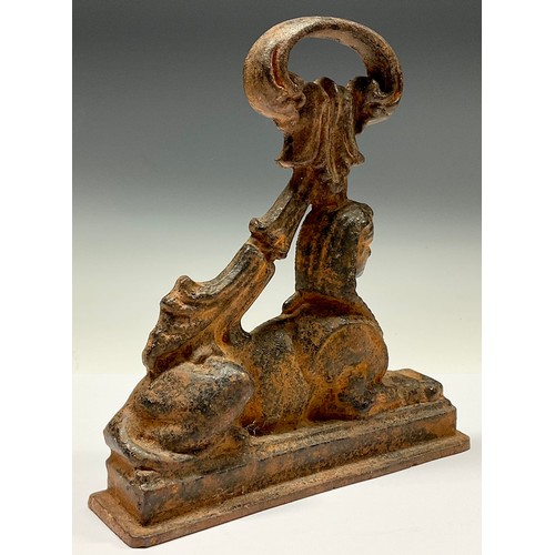 3021 - A 19th century Egyptian Revival cast iron door stop, as a Sphinx, 25cm high